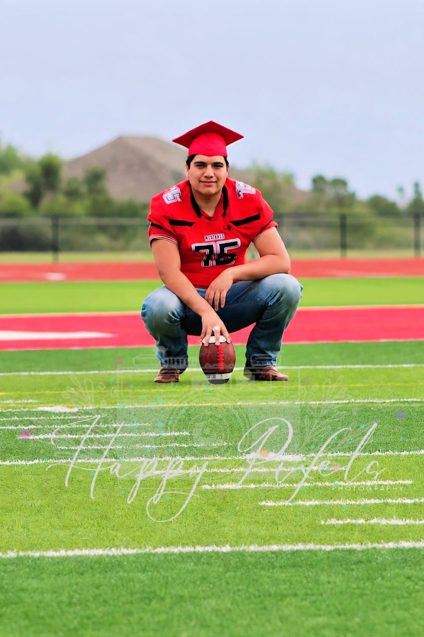 Senior football portrait on the field